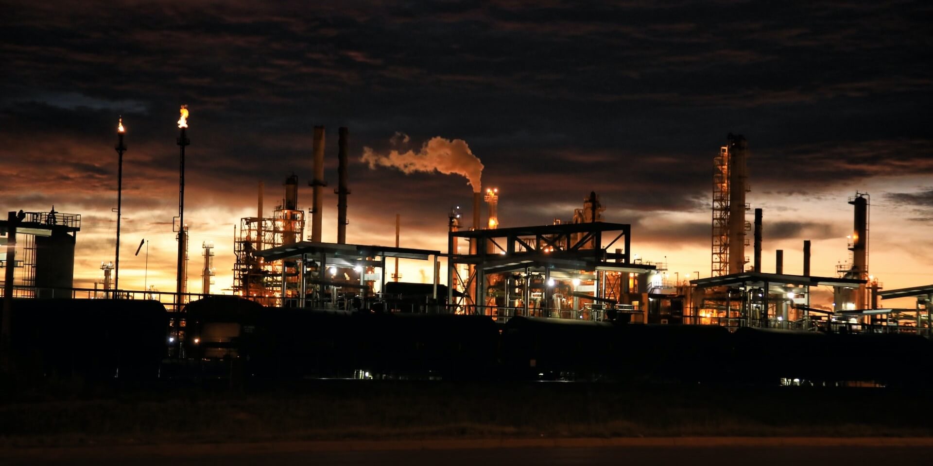 industrial plant lit up at night